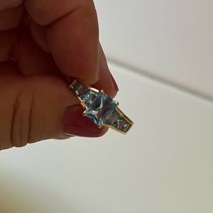 14k yellow gold Blue Topaz ring . Size 8.